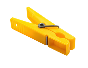 A close-up of a bright yellow clothespin on a black background
