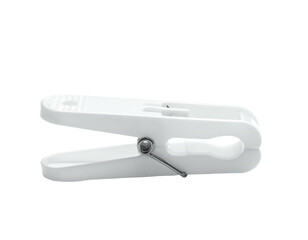 A close-up of a white plastic clip, used for holding items, isolated on black