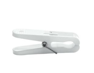 A close-up of a white plastic clip, used for holding items, isolated on black