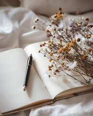 Aesthetic Notebook with Pen and Dry Flowers on White Bed