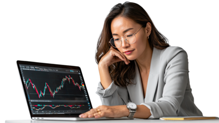 Financial Insight: An Asian businesswoman in professional attire, meticulously studies a stock market graph on a laptop, demonstrating a moment of deep concentration and business acumen.