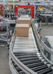 packing line in a logistics warehouse. conveyor belt in a modern production line