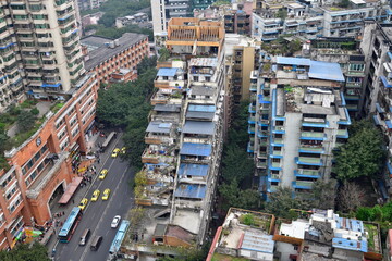 Fototapeta premium Yuzhong District, Chongqing, China: A unique staircase-shaped building.