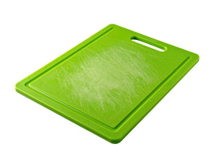 An angled, worn, green rectangular cutting board with a handle slot, on black