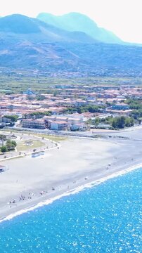 Calm Beachview in a Coastal Town During Sunny Day With Clear Skies and Gentle Waves. Italy, Santa Maria del Cedro