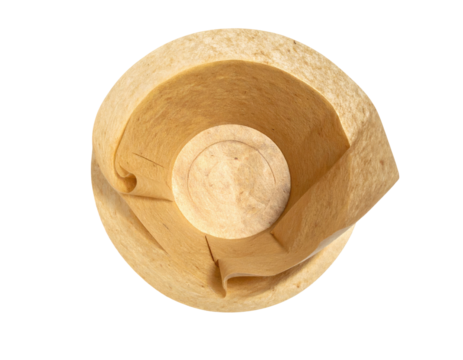 Overhead view of layered brown and tan food, possibly a tortilla, on black