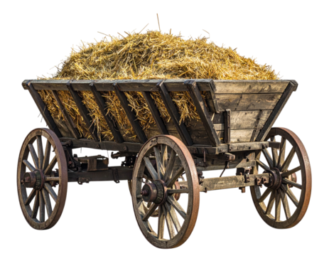 Antique wooden wagon filled with golden hay, isolated against a black background