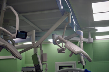 Modern surgical light system in an operating room. Medical facility equipment. Healthcare technology for urgent hospital care.