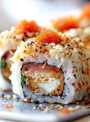 Rice roll fried filling, salmon, tobiko, sesame, seaweed