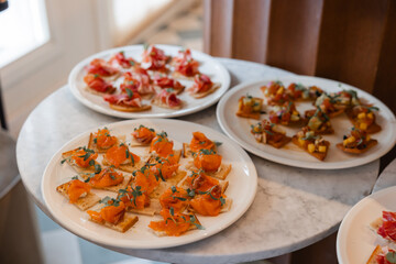 Colorful canapés with salmon and vegetables
