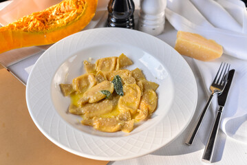 Ravioli with pumpkin in a plate on the table