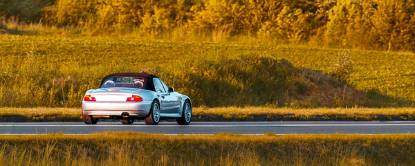 Vintage Japanese auto from nineties in countryside
