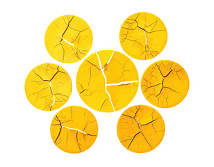 Seven cracked yellow circles arranged in a flower-like pattern on a black background
