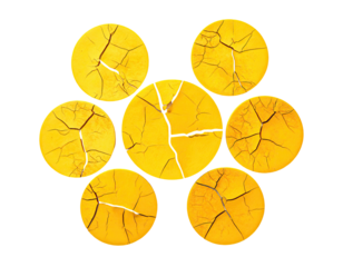 Seven cracked yellow circles arranged in a flower-like pattern on a black background