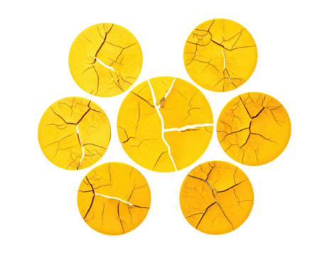 Seven cracked yellow circles arranged in a flower-like pattern on a black background