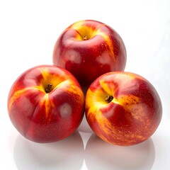 Three vibrant nectarines on white background