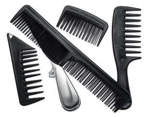 Several black plastic combs of varying sizes and designs, arranged on black