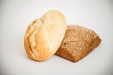 Freshly baked bread rolls on a white background