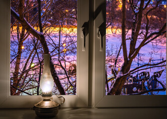 Cozy Winter Night Scene Through Window with Oil Lamp