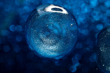 The surface of the cosmetic product has bubbles. blurred background. soft focus