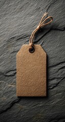 Blank kraft paper tag on dark stone