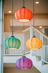 Colorful pendant lights hang, interior staircase backdrop