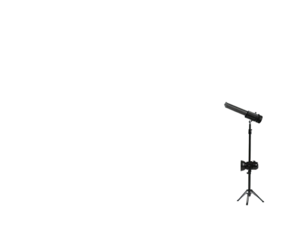 Silhouette of a microphone on a tripod, stark against a black background