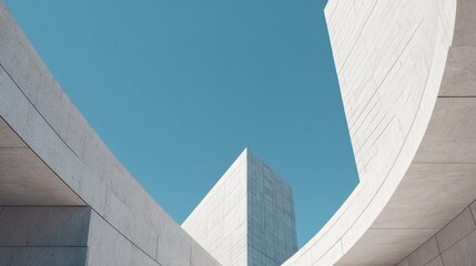 Striking Abstract Architecture with Curving Walls Against a Blue Sky