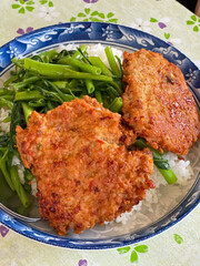 Rice topped with stir fried minced pork and basil. Stir fried curry paste in Thailand.