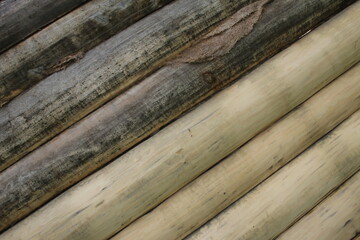 beautiful natural wooden logs stacked in a row