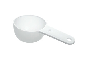 White plastic measuring scoop with handle on black background