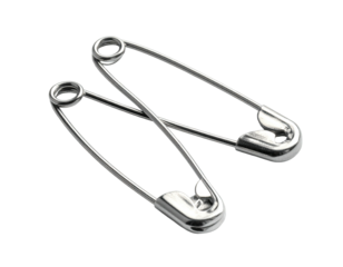Two silver, metal safety pins, overlapping with shadows on a black background
