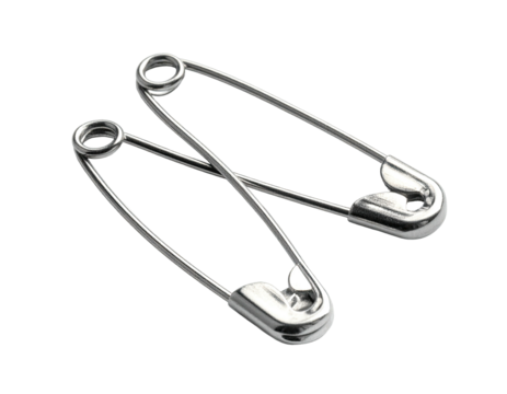 Two silver, metal safety pins, overlapping with shadows on a black background