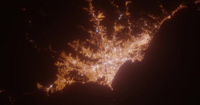 Lima (Peru) top view at night. Aerial view on modern city with lights. Camera is flying above the city, moving backward. Vertical video. The north is on the left side