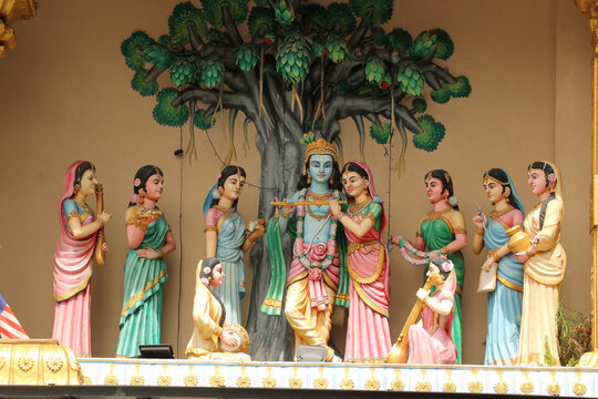 Statues of Lord Krishna with Gopis on the rooftop of a Hindu temple in Kuala Lumpur, Malaysia.