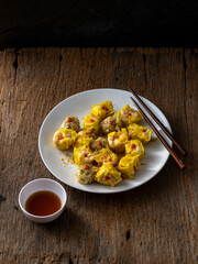 Delicious Dumplings Served with Sauce and Wooden Chopsticks