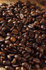 Close-Up of Roasted Coffee Beans on a Wooden Surface Background