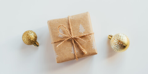Christmas gift box and decorations on white background