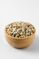 Organic Grains in Wooden Bowl Isolated on White Background