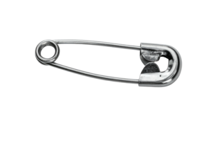 A close-up, black and white shot of a shiny, metallic safety pin