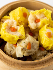 Delicious Dumplings in Bamboo Steamer Garnished with Carrots