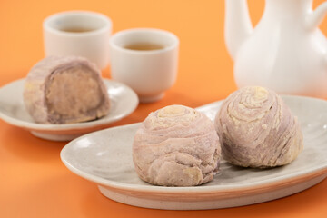 Taro puff pastries with teapot and cups for Mid Autumn Festival