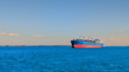 Large ship anchored in the middle of the great St. Lawrence River in Canada