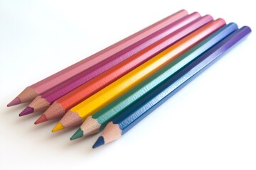 Fototapeta premium Six colorful pencils lined up diagonally on a white background, representing creativity, education, and artistic expression