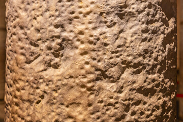 Rough textured stone surface with natural patterns and erosion marks