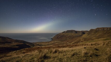 Night Sky Over Coastal Hills and Ocean