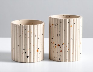 Two ribbed terrazzo pots; light background, studio setting