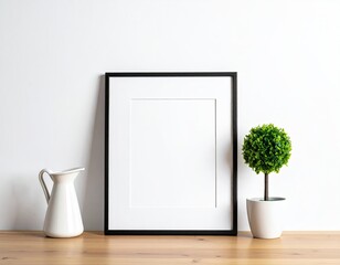 Minimalist frame, pitcher, topiary against white wall