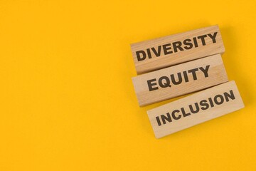 Wooden Blocks With Words Diversity, Equity, Inclusion Isolated On Yellow Background