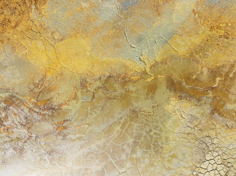 Aerial view of swirling, ochre-stained earth reveals the dramatic textures and mineral-rich landscapes of Minas de Riotinto, Andalusia, Spain.